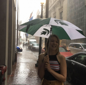 Madeleine Dahm with a Spartan umbrella in the city