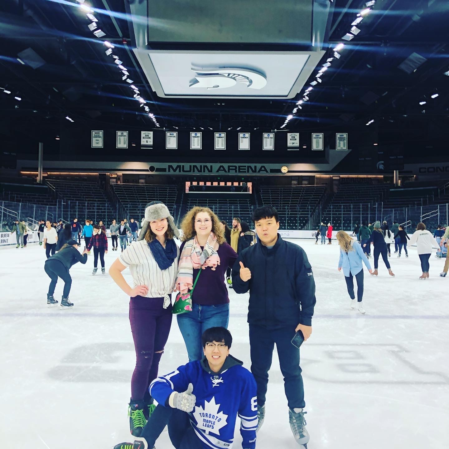 Jin Lee with other graduate students at Munn Arena